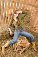 Provocative position young cowgirl on hay