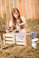 Redhead hippie young woman have breakfast in barn