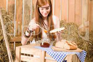 Redhead hippie woman have breakfast in barn