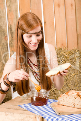 Redhead hippie young woman have breakfast in barn