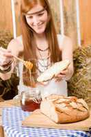 Redhead hippie woman have breakfast in barn