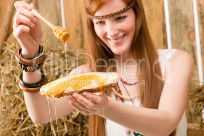 Redhead hippie woman have breakfast in barn