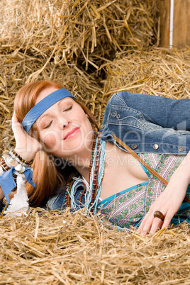 Young hippie woman lying on hay relax