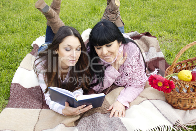 Mom and daughter reading a book