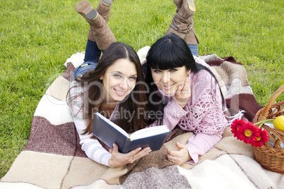 Mom and daughter reading a book