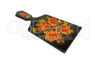 Russian traditional black cutting board painted with flowers isolated