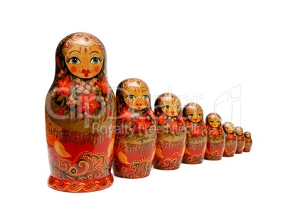 Row of Russian Babushka nesting dolls isolated