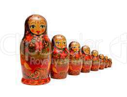 Row of Russian Babushka nesting dolls isolated