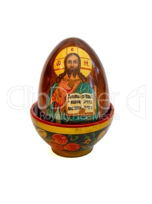 Russian easter egg with Jesus Christ in wooden cup on white background