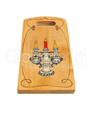 Wooden cutting board painted with candlestick isolated