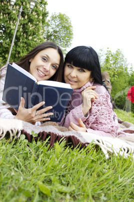 Mom and daughter reading a book