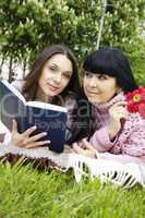 Mom and daughter reading a book