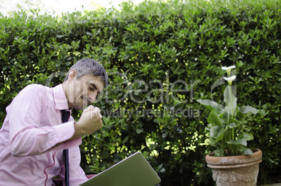 Man Working Outside Angry with his Laptop