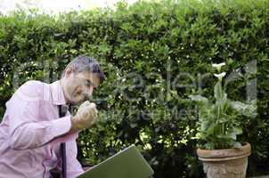 Man Working Outside Angry with his Laptop