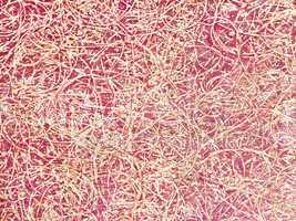 burgundy background with splashes of fibers in the form of flour
