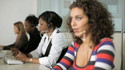 Businesswoman with call center female workers