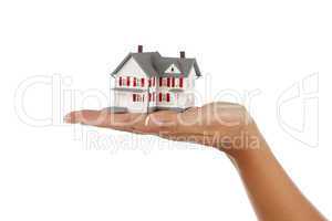 House in Female Hand on White