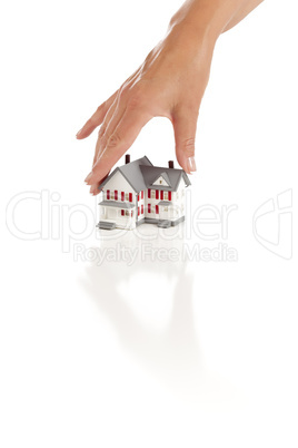 Womans Hand Choosing A Home on White