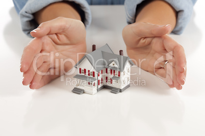 Womans Hands Around Model House