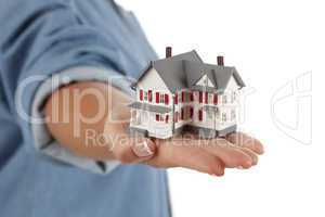 House in Female Hand on White