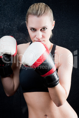 Boxing training woman with gloves in gym