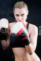 Boxing training woman with gloves in gym