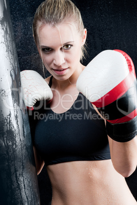 Boxing training woman with gloves in gym