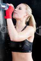 Boxing training woman pour water on her face