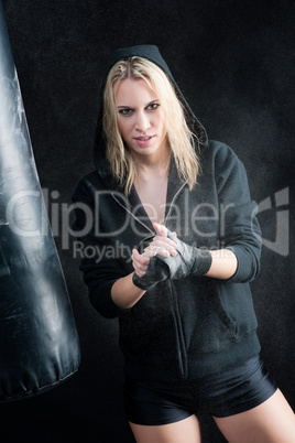 Blond boxing woman in black prepare training