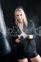 Blond boxing woman in black prepare training