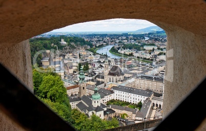Salzburg city view through the gun-slot of hohensalzburg castle in Austria