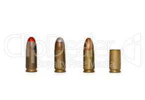 Row of three 9mm Parabellum cartridges of several types and spent case isolated
