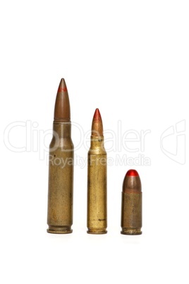 Three red-tipped tracer cartridges of various calibers isolated