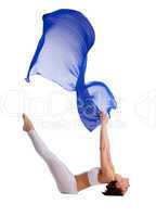 woman lay in yoga asana with blue fabric isolated