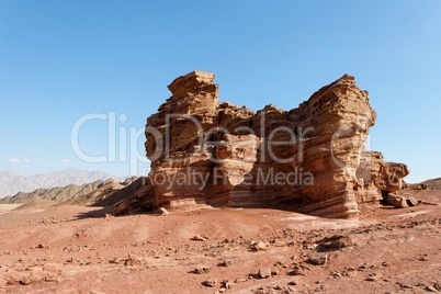 Scenic weathered orange rock in stone desert