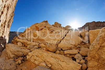 Run setting behind the yellow sandstone rock in the desert