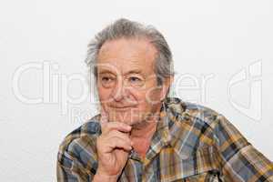 Elderly man with thoughtful expression