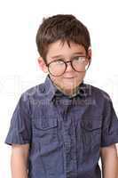 Little boy in funny round spectacles stands isolated