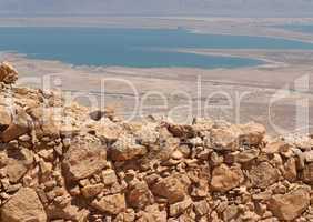 Wall of ancient Masada fortress ruin in the desert near the Dead Sea