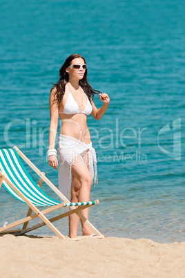 Summer woman sunbathing on beach wear bikini