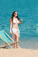 Summer woman sunbathing on beach wear bikini