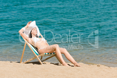 Summer slim woman sunbathing in bikini deckchair