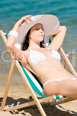 Summer slim woman sunbathing in bikini deckchair