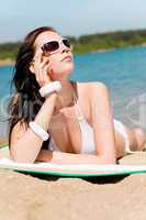 Summer beach stunning woman sunbathing in bikini