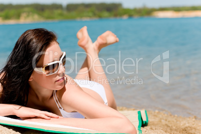 Summer beach stunning woman sunbathing in bikini