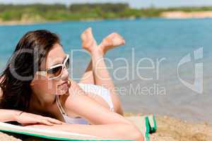 Summer beach stunning woman sunbathing in bikini