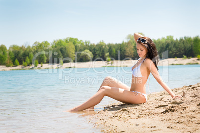 Summer beach stunning woman sunbathing in bikini