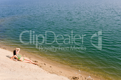 Summer woman in bikini alone on beach