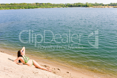 Summer woman in bikini alone on beach