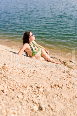 Summer woman in bikini alone on beach